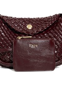 Burgundy woven leather handbag with a matching smooth leather zip pouch embossed with "Dune London" logo in gold.