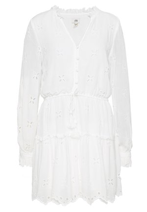 White long-sleeve mini dress with floral eyelet embroidery, buttoned V-neck, drawstring waist, and ruffled hem and cuffs.