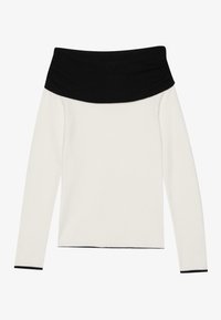 Off-the-shoulder top featuring a black ribbed neckline and long sleeves, made from soft cream fabric with black trim at the cuffs.