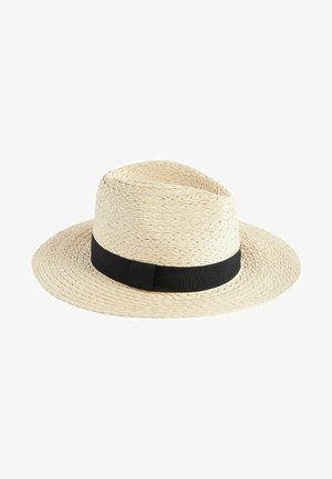 Leveled, wide-brimmed straw hat in natural beige with a black fabric band. The woven texture provides detail, creating a light and breathable design.