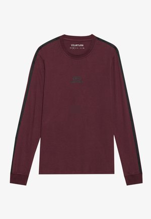 Burgunderrød langærmet skjorte lavet af bomuld, med sorte side-striber og et lille grønt logo på brystet. Casual crew neckline og ribbede manchetter.