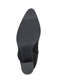 Black shoe sole with a textured rubber surface, rounded tip, and a smooth finish. Features a size label (37) near the heel.