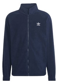 Marinblå fleecetröja med hög krage, hel dragkedja och elastiska ärmslut. Har en vit Adidas-logga på vänster bröst. Mjuk textur.