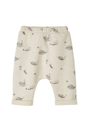 Light beige children's pants with a soft texture, featuring black whale and jellyfish patterns, elastic waistband, and cuffed hems.