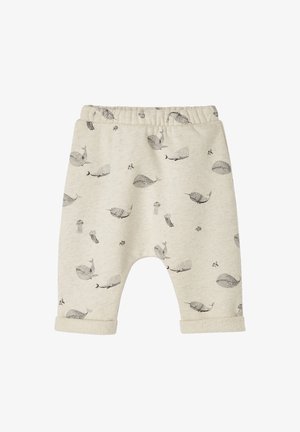 Light beige children's pants with a soft texture, featuring black whale and jellyfish patterns, elastic waistband, and cuffed hems.