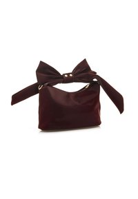 Borsa a mano in pelle patinata color bordeaux con grande applicazione a fiocco, chiusura con zip e tracolla removibile. Texture liscia, design elegante.