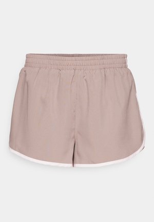 Athletic shorts in light beige fabric with an elastic waistband, featuring a contrasting white trim along the edges and a loose fit design.