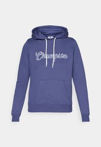 Purple hoodie with a front pocket, drawstring hood, and "Champion" logo in script. Made from a soft, textured fabric with elastic cuffs.