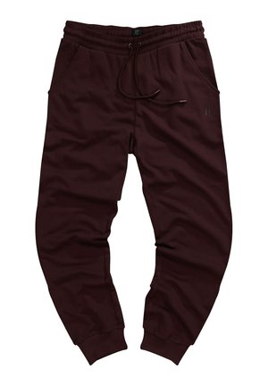 Pantaloni jogger bordeaux realizzati in tessuto morbido, con vita elastica e cordino, due tasche laterali e polsini stretti.