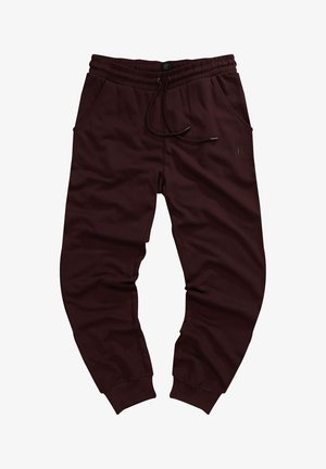 Burgunderfarbene Jogginghosen aus weichem Stoff, mit einem elastischen Bund und Kordelzug, zwei Seitentaschen und schmal zulaufenden Bündchen.