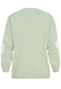 Mintroheline kampsun tekstuurse kudumismustriga, millel on valged lillemustrid varrukatel ja ümara kaelusega.