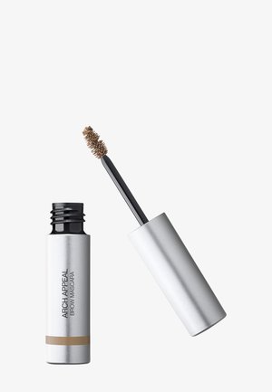Tube argenté de mascara à sourcils marron Arch Appeal avec l'applicateur en baguette relevé, montrant la brosse goupillon enduite de produit.