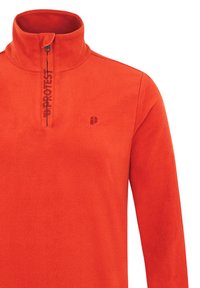 Pullover in pile arancione con colletto a metà zip. Presenta un piccolo logo impresso e un gancio per facilitare l'accesso alla zip sul davanti.