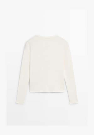 Lysecreme langærmet top med rund halsudskæring og cropped pasform. Lavet af blødt, glat stof uden synlige mønstre eller udsmykninger.