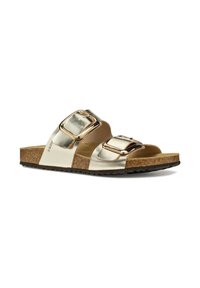 Sandali metallici oro con due fibbie regolabili, soletta simile al sughero e suola nera strutturata. Superficie superiore liscia e design piatto.