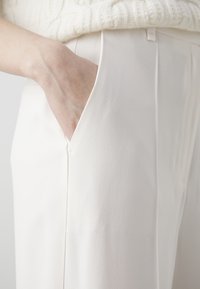 BOSS Trousers - off-white