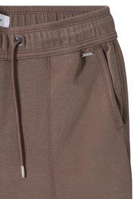 Pantalon marron à taille élastique avec cordon de serrage à l'avant, poche latérale et petite étiquette métallique de la marque près de la couture de la poche.