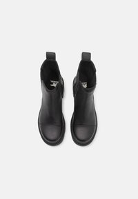 Black leather ankle boots with elastic side panels, rounded toes, and pull tabs. Smooth texture with stitching details and logo insole.