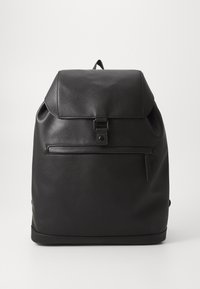 Black leather backpack with a folded top flap, a front zipper pocket, and a smooth texture. Features a simple design with no visible branding.