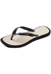 Sorte flip-flop sandaler med teksturerte stropper, med en glatt beige såle og en tykk svart gummisåle.