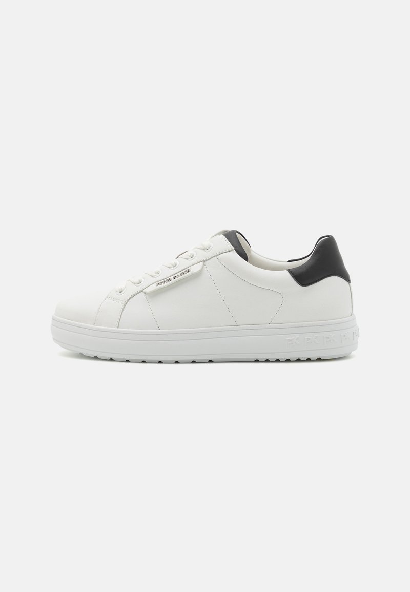 White leather sneakers with a black heel accent, flat rubber outsole, and tonal stitching. Features lace-up closure and brand detailing on the side.