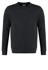 Felpa nera a maniche lunghe con una fantasia a macchie bianche che assomigliano a piccole stelle, scollo a girocollo e polsini e orlo a coste.