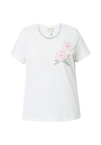 Camiseta de algodón blanca con cuello redondo. Presenta bordados florales en rosa y verde en el lado izquierdo. Ajuste casual y relajado.