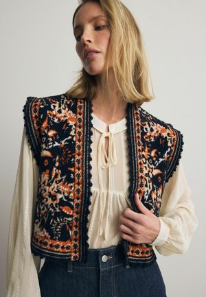 Next REGULAR FIT - SLEEVELESS PATTERN GRAPHIC - Liivi - black