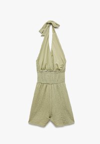 Groene, gestructureerde romper met een smock-borststuk en halternek. Kenmerkt een losvallend ontwerp met korte pijpen. Zachte stof met een casual uitstraling.