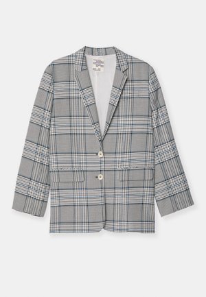 Grå og hvid ternet blazer med en spids krave, to frontlommer og to knapper. Fremstillet af glat stof med en struktureret pasform.