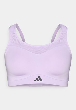 Hellvioletter Sport-BH mit dünnen Trägern, Mesh-Detail am oberen Teil und schwarzem Logo vorne. Glatter Stoff mit elastischer Passform.