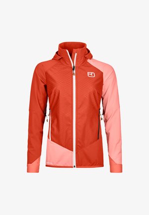 Red and pink athletic jacket with a hood, zip front, textured design, contrasting sleeves, and adjustable drawstrings. Features logo on chest.
