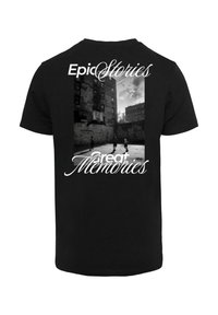 Black t-shirt featuring a large textual design with "Epic Stories" and "great Memories," complemented by a grayscale basketball scene.