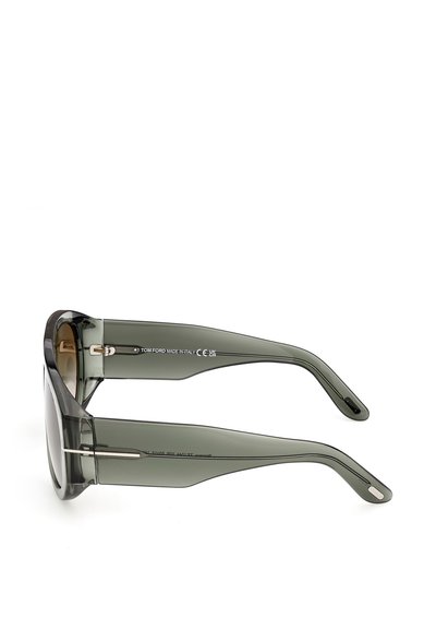 Lunettes de soleil surdimensionnées gris translucide avec des branches épaisses et des verres foncés, vues de côté sur un fond blanc.