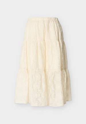 Jupe à volants couleur crème avec taille élastique et broderie florale en œillet, longueur midi, tissu léger.