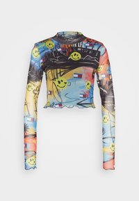 Long-sleeve, cropped top made of sheer fabric featuring a colorful abstract print with smiley faces, flags, and a wave-like hem.