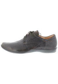 Braune Lederdressschuhe mit glatter Textur, runder Zehenform, subtilen Nähdetails und Schnürdesign. Mit einer flexiblen Gummisohle.