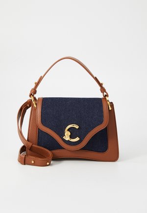 Brown leather handbag with navy denim flap, gold hardware, and C-shaped emblem. Includes a top handle and adjustable shoulder strap.