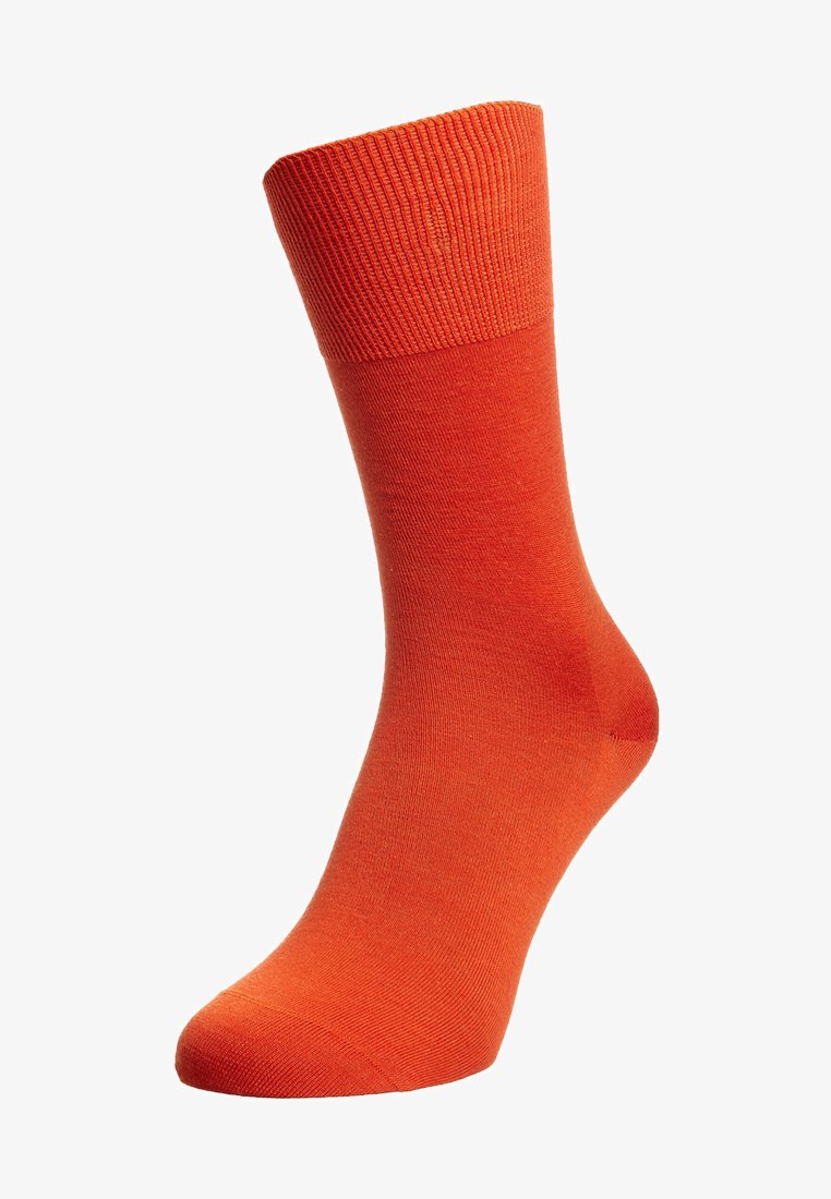 Oransje sokk med en ribbestrikket mansjett, glatt tekstur og en tilpasset form. Ingen synlige mønstre eller hardware-detaljer.