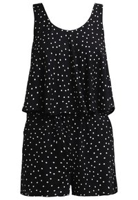 Rompers à pois noirs présentant un haut superposé au coupe ample avec de larges bretelles et une taille élastique pour un confort optimal.