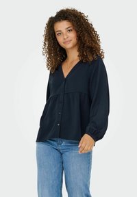 Navy blue button-up blouse in lightweight fabric. Features a V-neck, gathered bodice, and long sleeves with elastic cuffs.