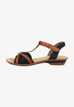 Women's sandal with a black fabric upper, brown leather accents, T-strap design, textured footbed, and a low wedge heel.