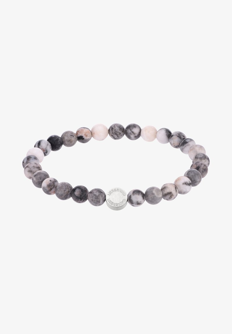 Bracelet extensible avec des perles rondes marbrées noires et blanches et une petite perle argentée gravée du mot "Liebeskind."