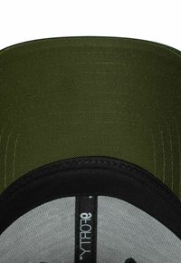 Dark green structured cap with a black bill and a gray top. Features textured fabric and a stitched logo on the interior band.