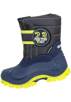Navy blue winter boot with a rugged rubber sole. Features a padded fabric shaft with yellow accents and a circular logo patch on the side.