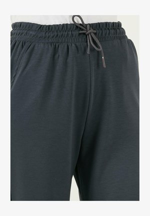 Pantalones deportivos gris oscuro hechos de una tela suave y texturizada. Cuentan con una cinturilla elástica con cordón ajustable para un ajuste personalizable.