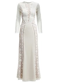 Longue robe blanche avec manches en dentelle et panneaux latéraux, motifs géométriques en dentelle et tissu uni au centre devant et derrière.