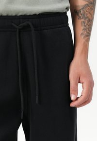 Abercrombie & Fitch ESSENTIAL BAGGY OPEN HEM CASUAL - Jogginghose - black