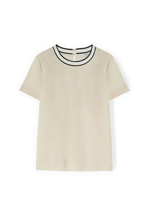 T-shirt à manches courtes en tissu beige, avec un col rond bordé de noir et une fermeture en œillet au dos. Texture lisse avec un design minimal.