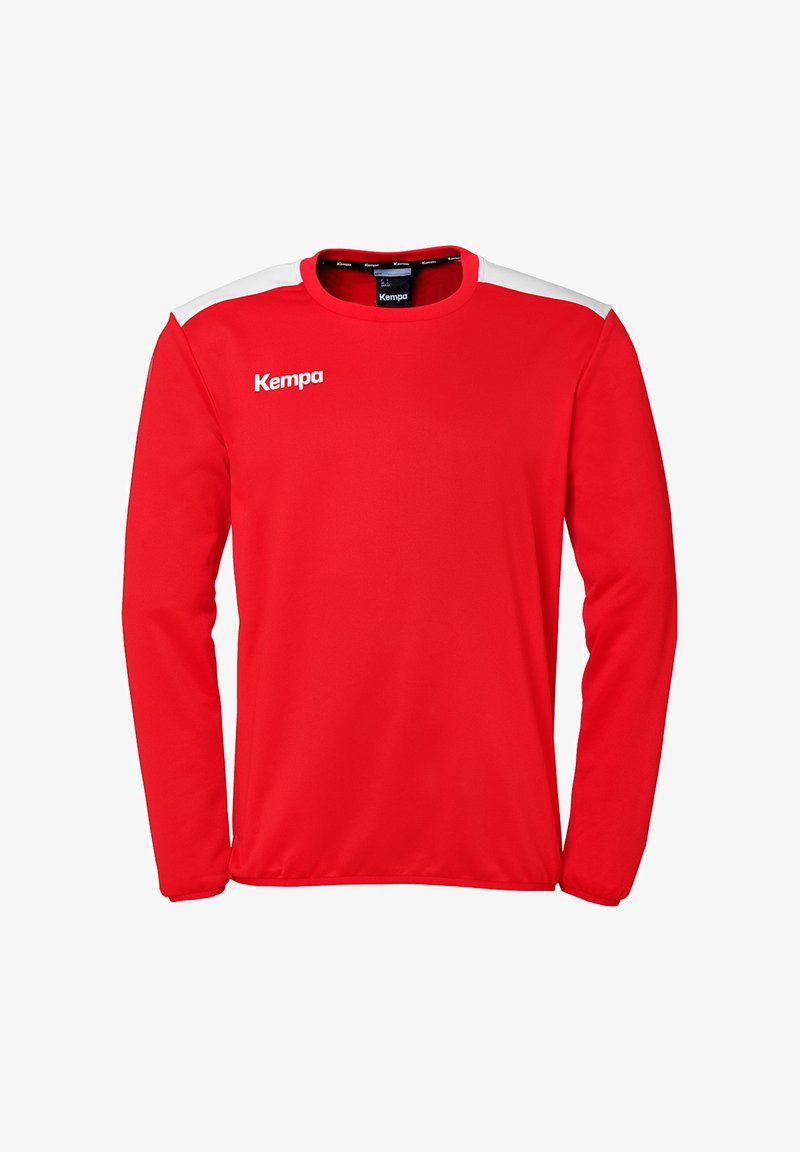 Rode shirt met lange mouwen van zacht materiaal, met witte schouderaccenten en een Kempa-logo aan de voorkant links. Gladde textuur.